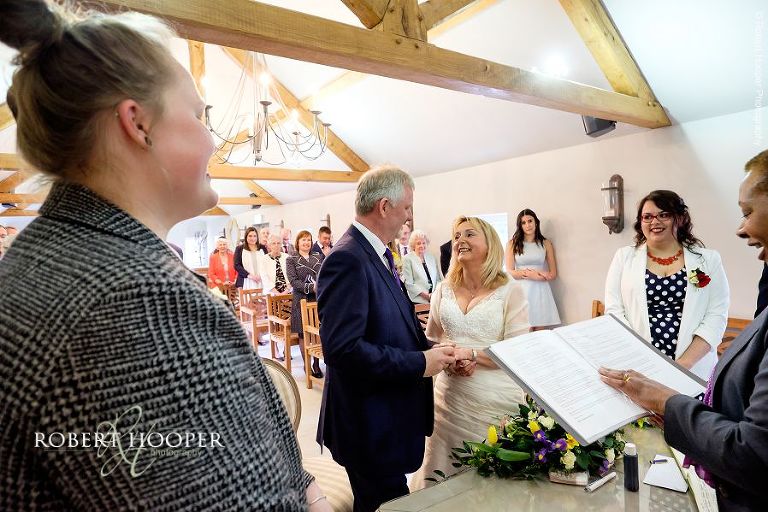 Bride and groom during their vows at Oaks Farm Barn civil wedding ceremony