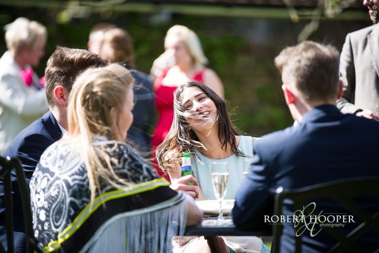 Wedding guests at drinks and canapes reception at Oaks Farm Barn in Surrey