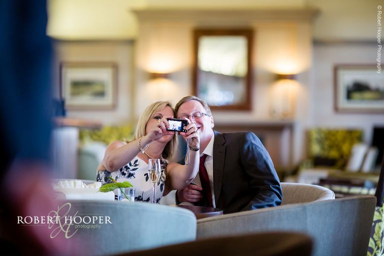 Guests at wedding reception taking a 'selfie' at London Golf Club in Kent