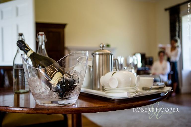 Champagne chilling on ice ready to open during bridal preps on wedding day at Botleys Mansion Surrey