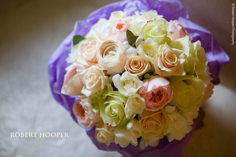 Brides bouquet of roses for her wedding day at Farnham Castle in Surrey