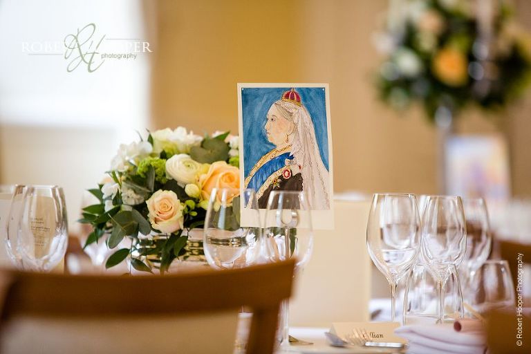 Table decorations for wedding breakfast at Farnham Castle Surrey
