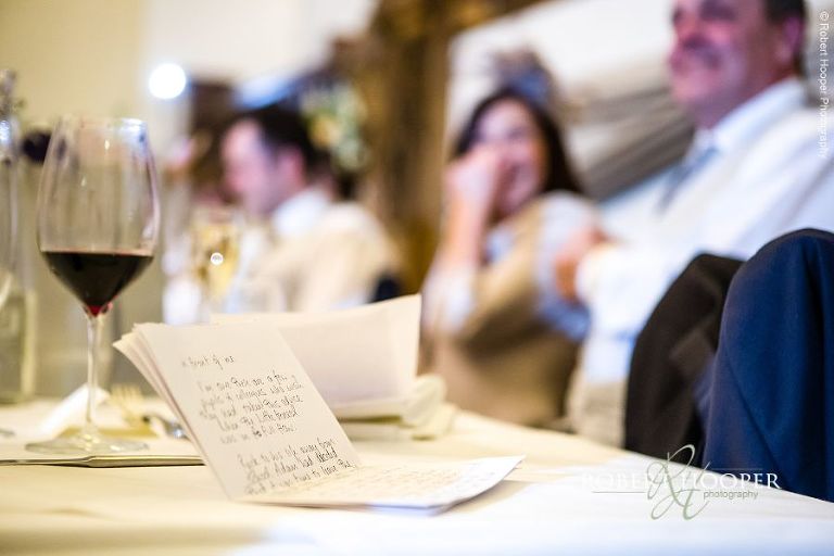 Copy of best man speech on table of wedding breakfast on wedding day at Farnham Castle