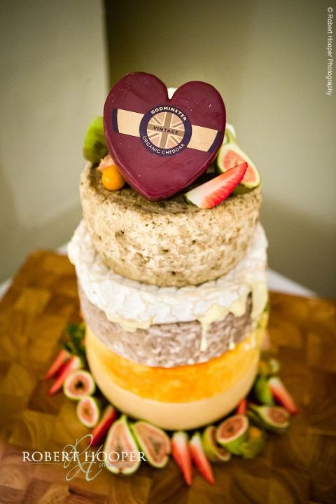 Wedding cake made from cheese at wedding celebration at Farnham Castle Surrey