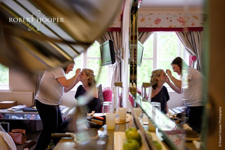 Bridal preps at The Mill at Gordleton in preparation for wedding day at at All Saints' Hordle Church Hampshire and The Three Tuns, Dorset