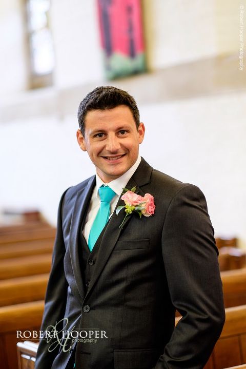 Portrait of groom in church before his wedding ceremony at All Saints' Church Hordle