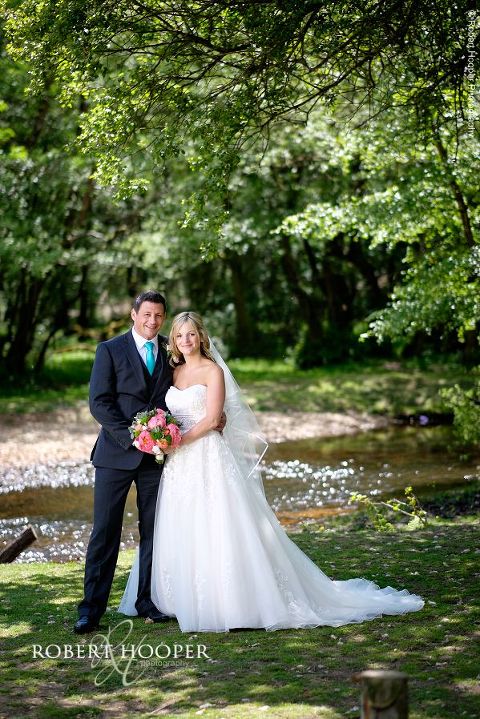 Bride and groom portraits in The New Forest on sunny summer's day just after their wedding at All Saints Hordle