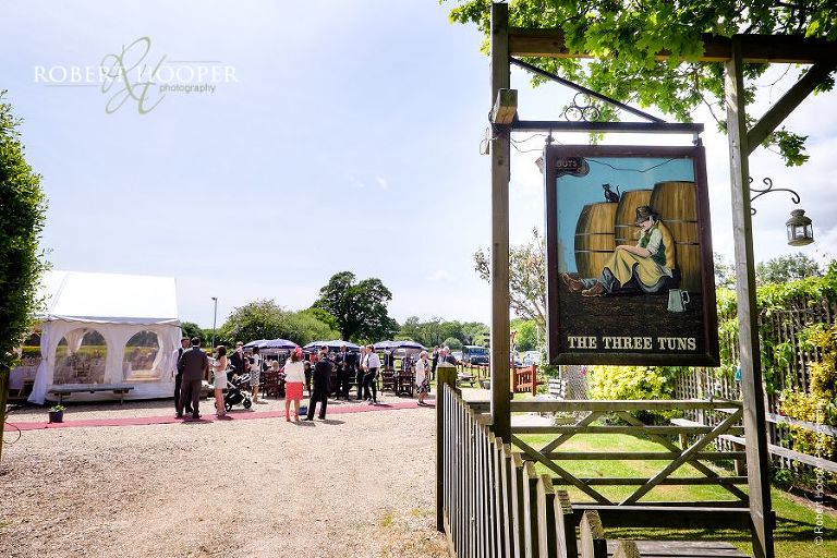 Wedding guests gathering for summer wedding reception at The Three Tuns Dorset