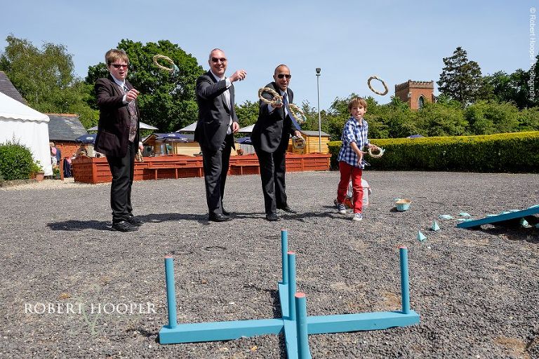 Wedding guests play hoopla or ring toss at wedding reception at The Three Tuns Bransgore, Dorset