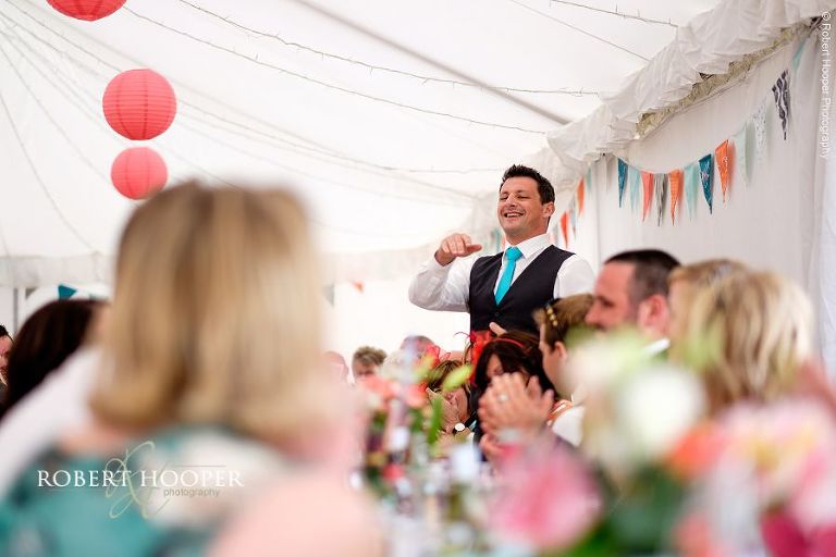 Grooms gives his speech at his wedding breakfast in the marquee at The Three Tuns Bransgore Dorset