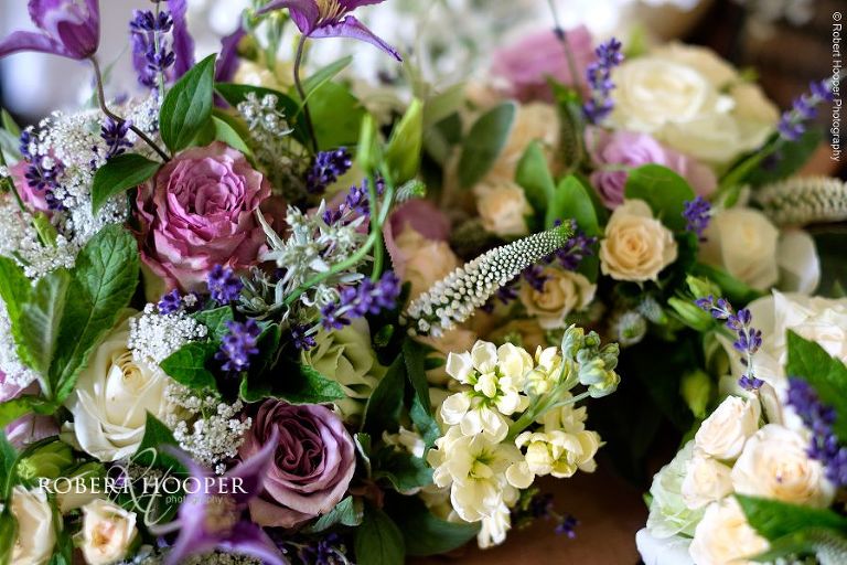 Beautiful bridal bouquet of flowers in pinks, purples and creams for wedding day at Eastwell Manor Ashford Kent