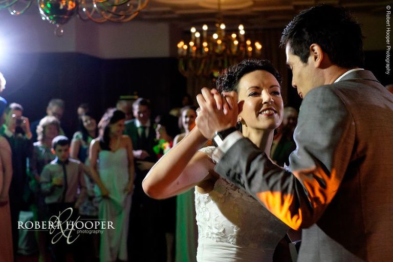 Newlyweds first dance as man and wife on their wedding day at Eastwell Manor Ashford Kent