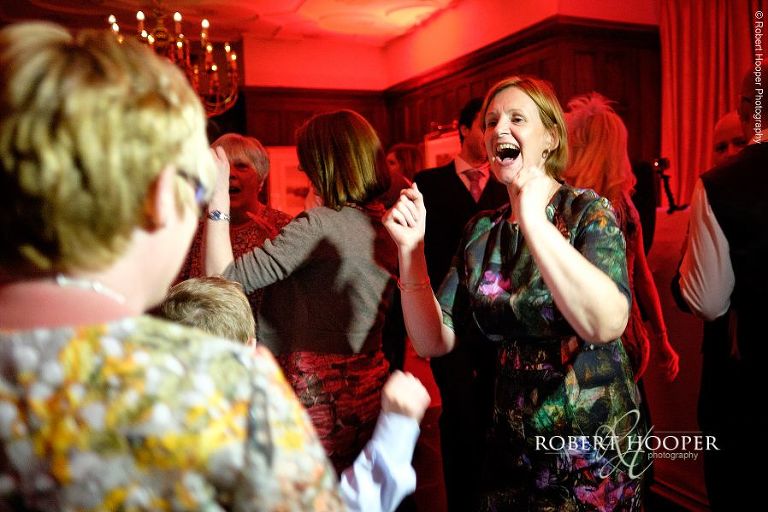 Wedding guests dancing at wedding at at Eastwell Manor Ashford Kent