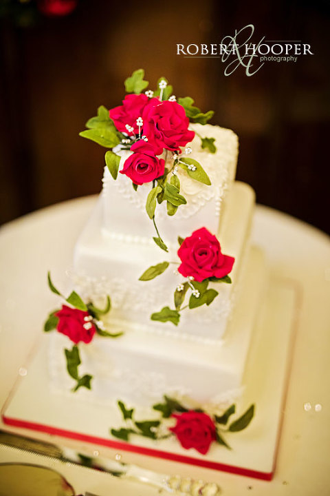 Rose decorated 3 tier wedding cake for wedding celebration held at The Rooms at Browns