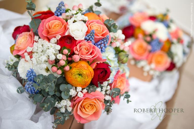 Bride's colourful mixed flower bouquet for wedding at Bookham Baptist Church Surrey and Loseley Park, Guildford Surrey