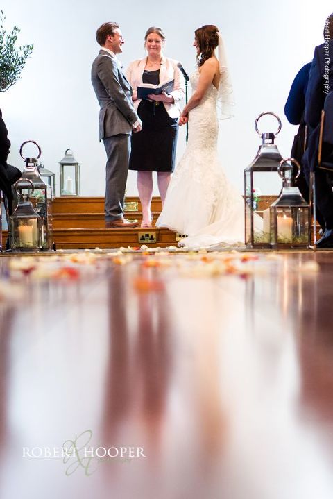Bride and groom making their vows during their wedding service at Bookham Baptist Church Surrey