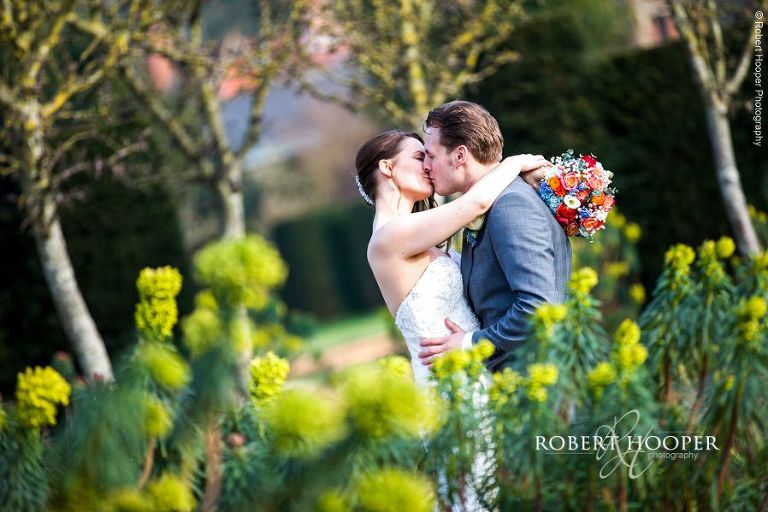 Bride and groom together in the walled garden at Loseley Park Surrey on their wedding day
