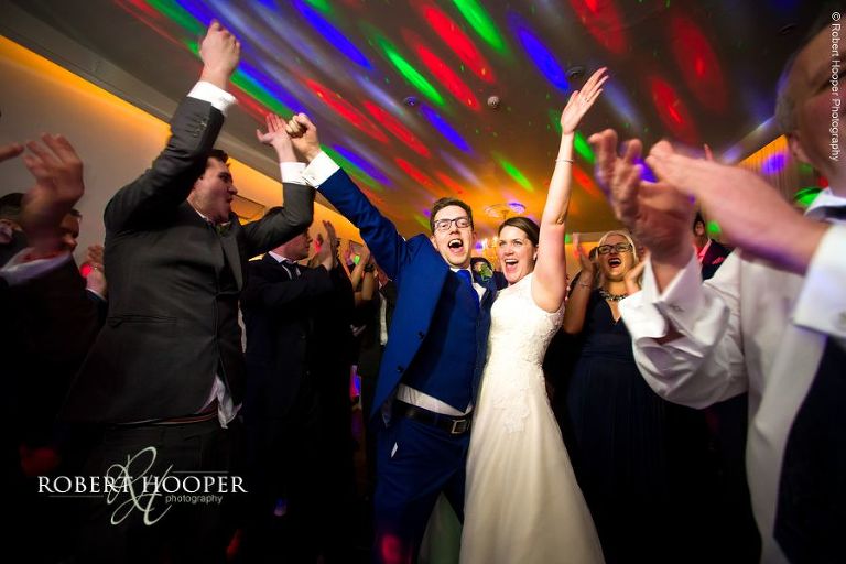 Bride and groom dancing with all their wedding guests on dance floor after first dance at Chilston Park in Kent