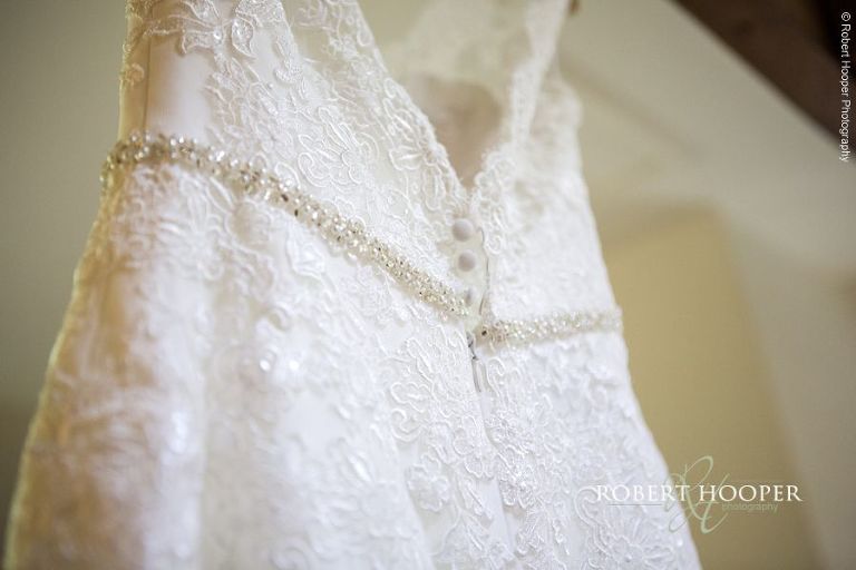 Wedding dress hanging in the cottage at Oaks Farm Barn Croydon Surrey