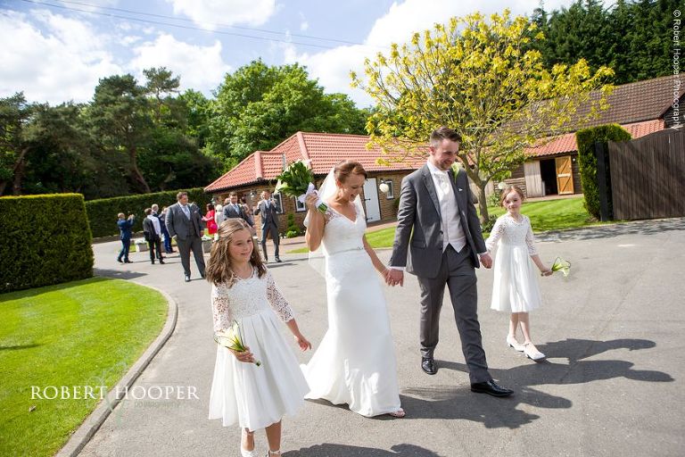 Bride and groom after their civil ceremony at Oaks Farm Barn Croydon Surrey