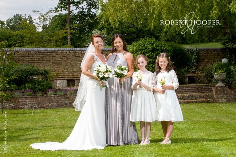 Bride, bridesmaid and flower girls on wedding day at Oaks Farm Barn Croydon Surrey