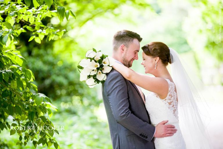 Bride and groom cuddle at Oaks Farm Barn Shirley Surrey on their wedding day