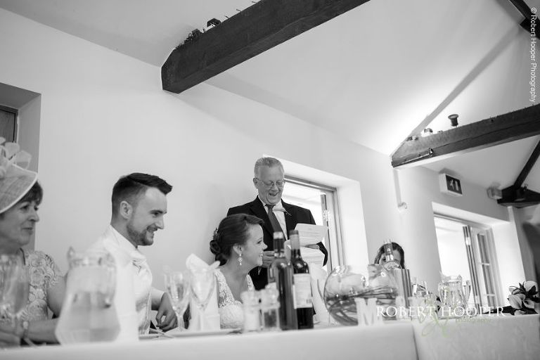 Father of the bride gives speech at wedding breakfast at Oaks Farm Barn Shirley Surrey