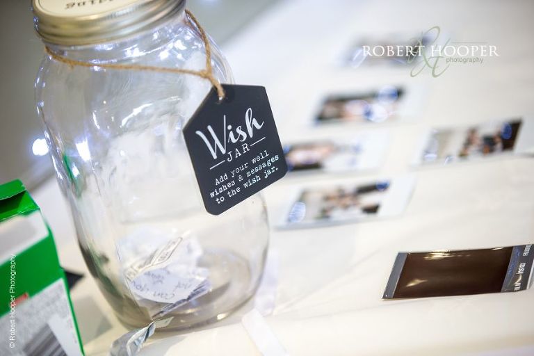 "Wish Jar" on table at wedding reception at Oaks Farm Barn Croydon Surrey