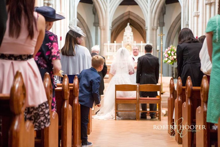 Bride and groom getting married at Sacred Heart Church Wimbledon