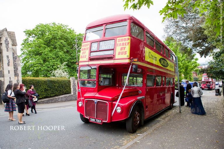 Red London bus to take wedding guests from Sacred Heart Church Wimbledon to Hampton Court House Surrey