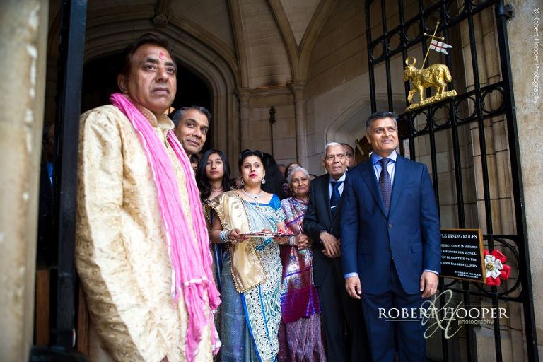 Wedding guests waiting for arrival of groom for Hindu ceremony at Middle Temple Hall London
