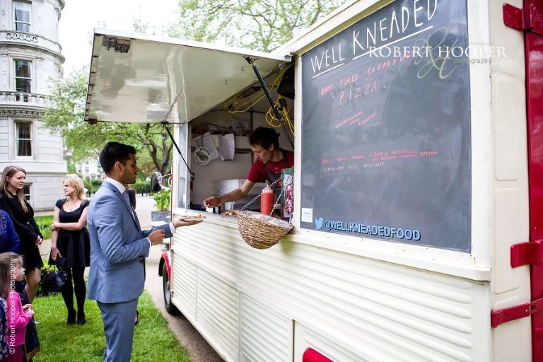 Wedding guests being served food from Pizza van at Middle Temple London