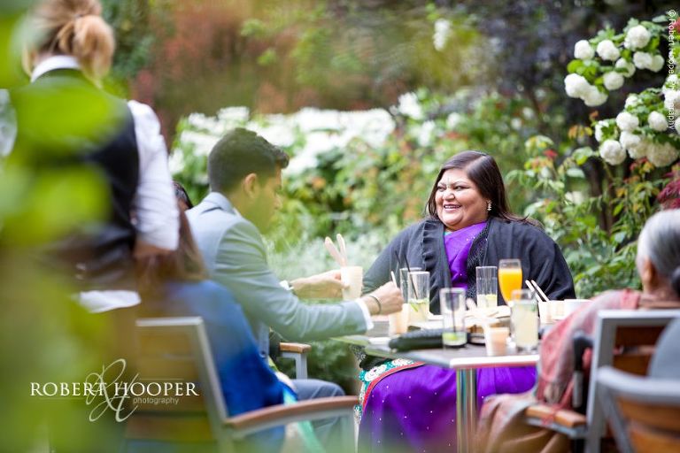 Guests enjoying sunshine at Hindu wedding at Middle Temple London