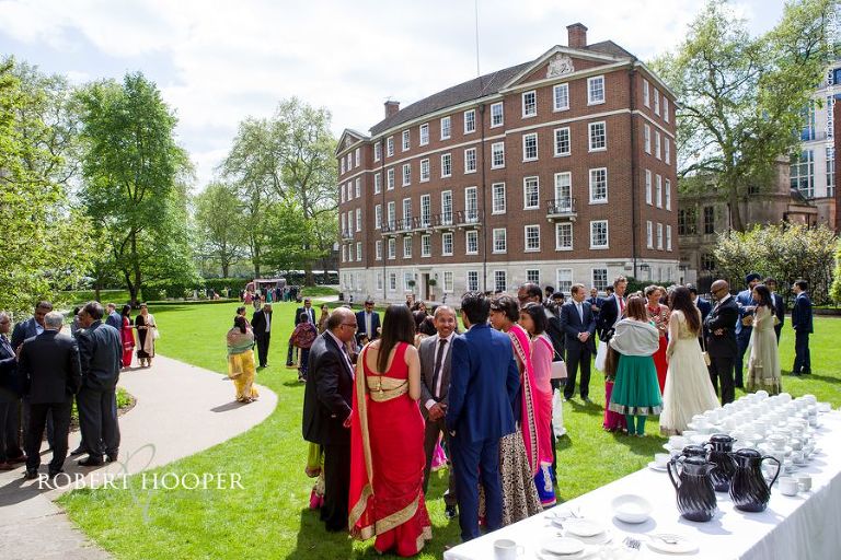 Wedding guests on the lawn for tea and coffee after Hindu ceremony at Middle Temple London