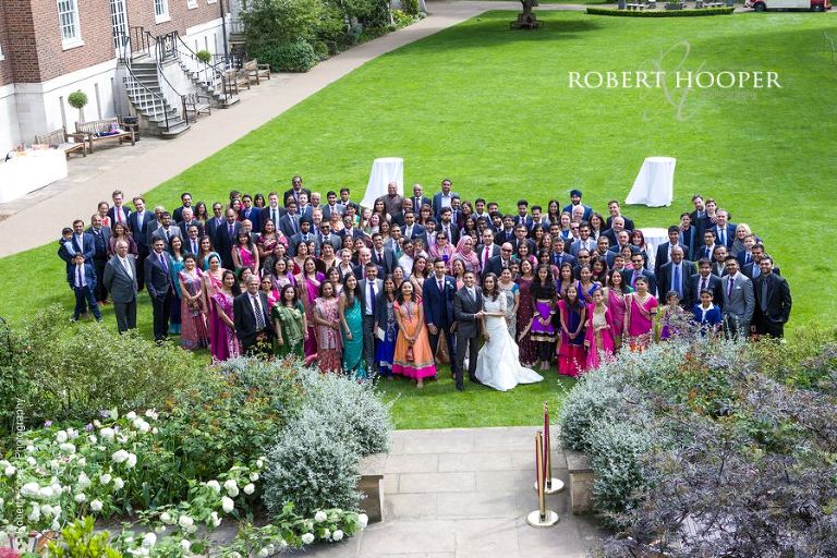 Group photography of all wedding guests on lawn at Middle Temple London