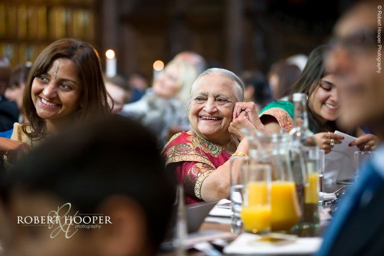 Wedding guests enjoying speech at wedding celebration at Middle Temple London