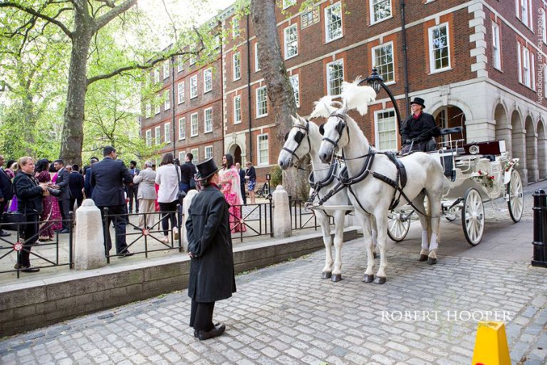 Horse and cart for bride and groom after wedding celebration at Middle Temple London
