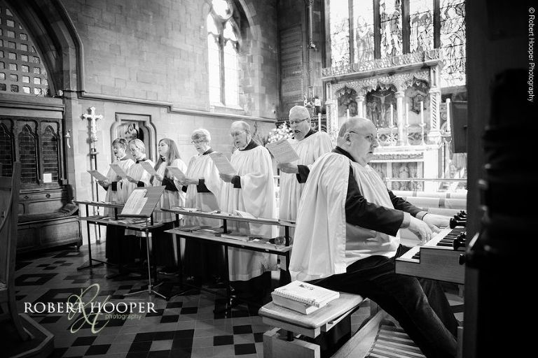 Organist and choir during hymns at wedding ceremony at St John's Evangelist Church Shirley Surrey