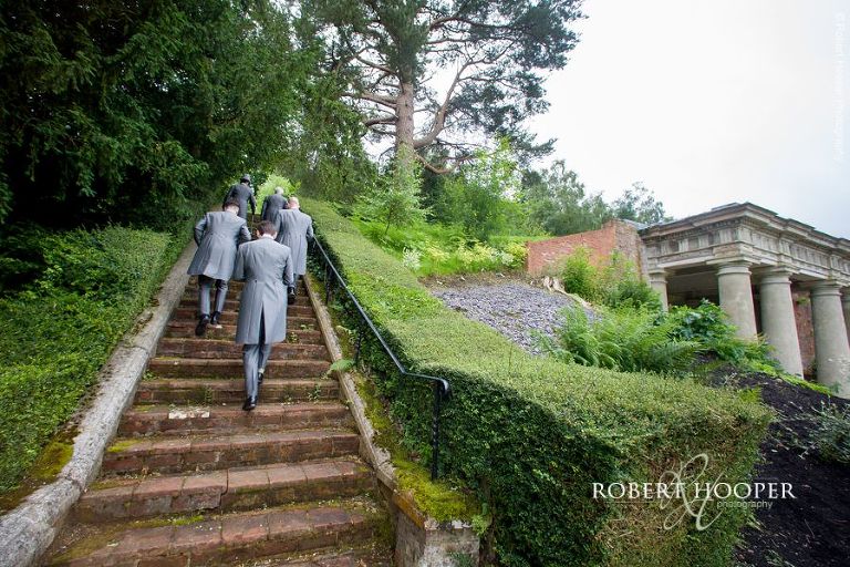 Groomsmen heading up to look at view and have a beer at Wotton House Dorking Surrey