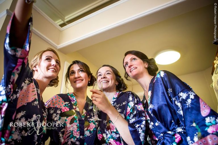 Bridesmaids take a selfie after make-up for wedding day at Wotton House Dorking Surrey