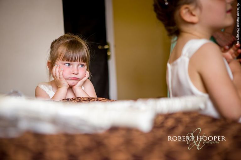 Flower girl during bridal preps at for wedding day at Wotton House Dorking Surrey