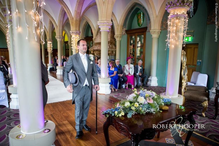 Groom waiting at the alter for his bride to arrive on wedding day at Wotton House Dorking Surrey