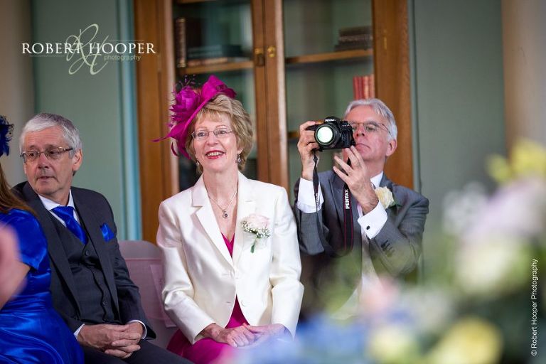 Mother of the bride awaiting arrival of the bride at wedding ceremony at Wotton House Dorking Surrey