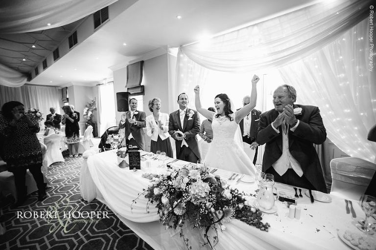 Bride and groom entrance to wedding breakfast at Wotton House Dorking Surrey