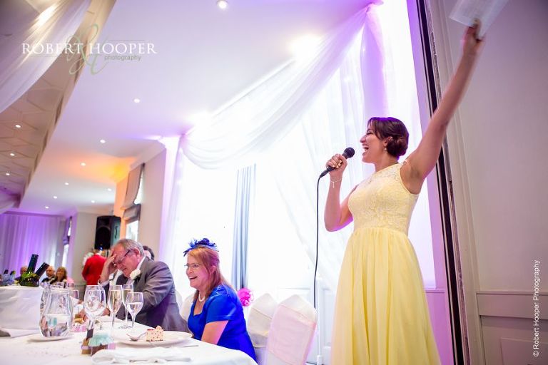 Bridesmaid gives a speech at wedding breakfast at Wotton House Dorking Surrey