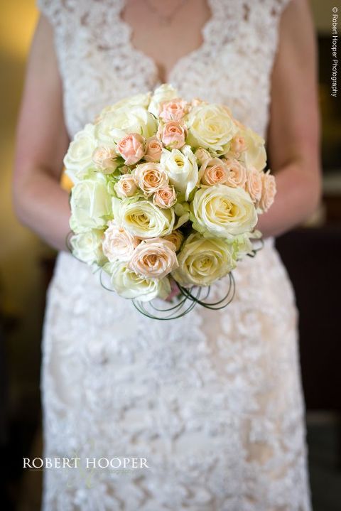 Bride's bouquet of pale apricot and yellow roses for wedding at Chilston Park Hotel Maidstone Kent