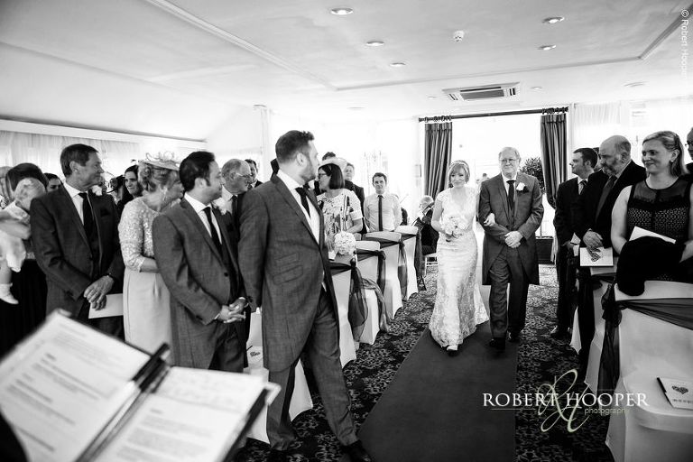 Bride walking down the isle on wedding day at Chilston Park Hotel Maidstone Kent
