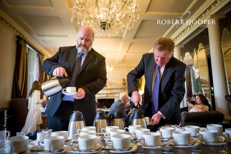 Guests helping themselves to tea and coffee after sit down meal on wedding day at Chilston Park Maidstone Kent