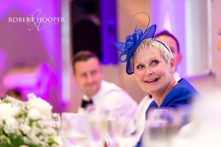 Wedding guests laughing at speeches during wedding breakfast at Wotton House Dorking Surrey