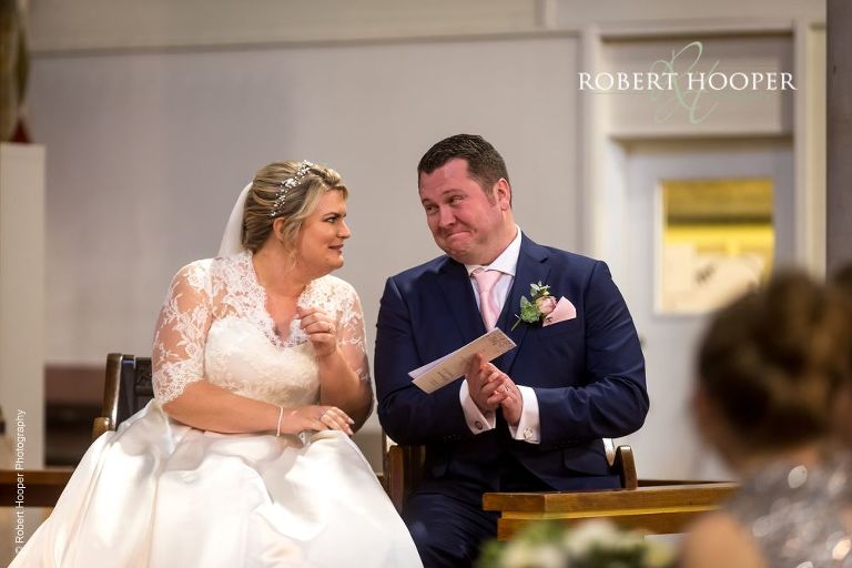 Bride and groom during wedding ceremony at St Martthew's Church in Surbiton Surrey